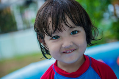 Portrait of cute boy in swimming pool