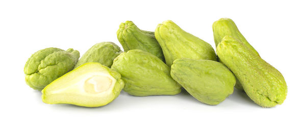 Close-up of green pepper against white background