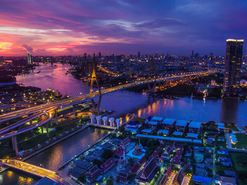 High angle view of illuminated bridge over river at night