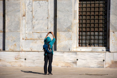 Woman photographing dome of the rock on the temple mount. jerusalem, israel