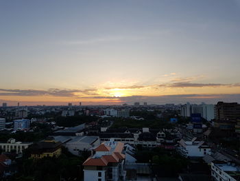 High angle view of buildings against sky during sunset