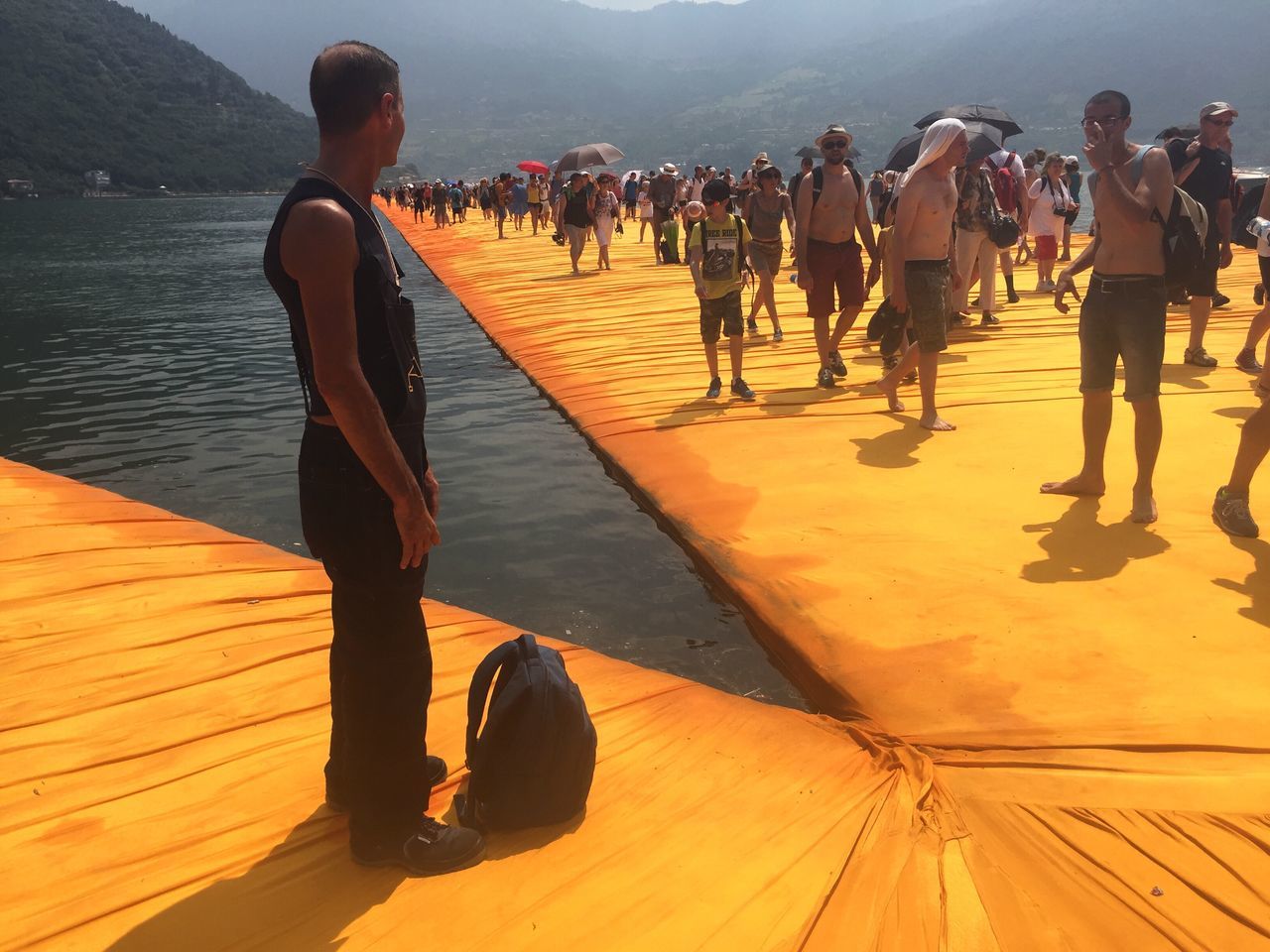 LOW SECTION OF PEOPLE WALKING ON PIER