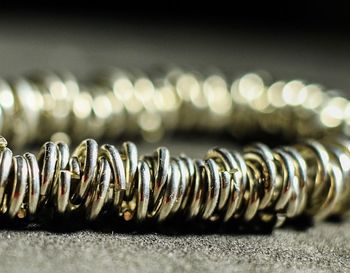 Close-up of spiral metal on table