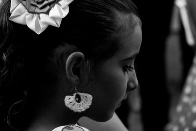 Side view of girl wearing earring outdoors