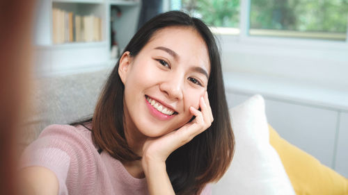 Close-up portrait of smiling woman