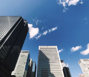 Low angle view of modern buildings against sky