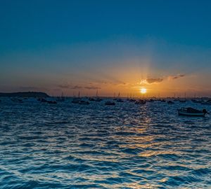 Scenic view of sea against clear sky during sunset