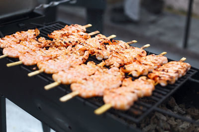 High angle view of meat on barbecue grill