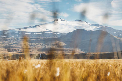 Panoramic view of snowcapped mountains against sky