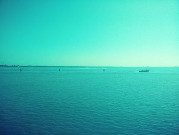 Scenic view of sea against blue sky