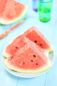 Close-up of red fruit in plate on table