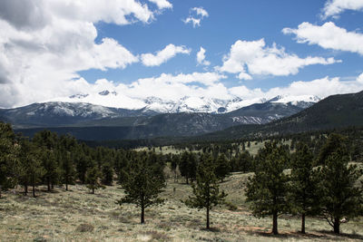 Scenic view of mountains against cloudy sky