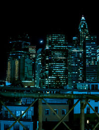 Low angle view of skyscrapers lit up at night