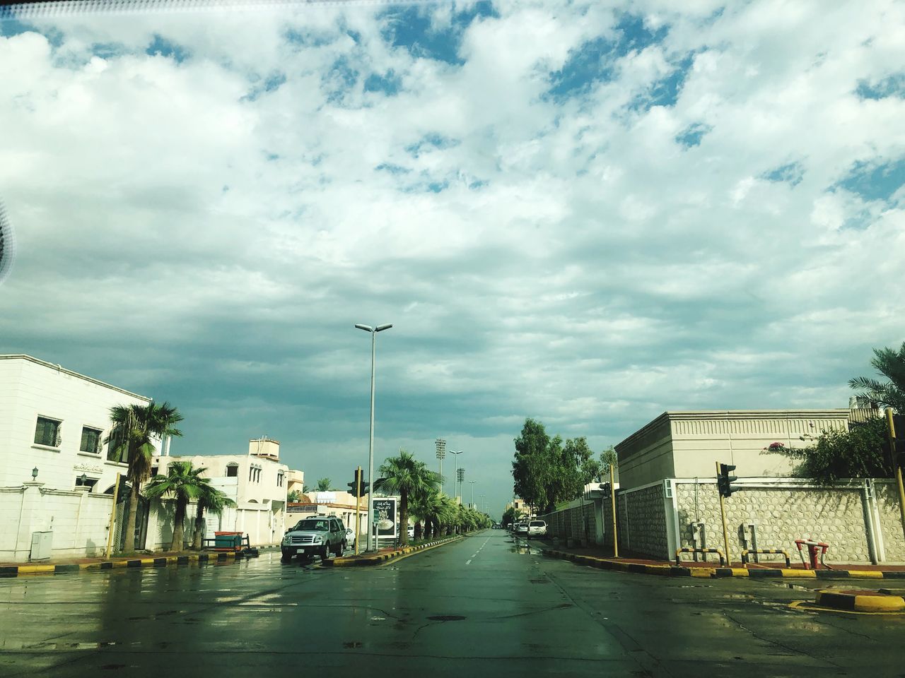 CARS ON STREET BY RAINY SEASON