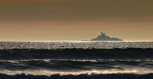 Scenic view of sea against sky during sunset