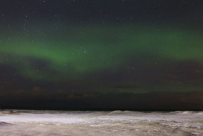 Scenic view of sea against sky at night