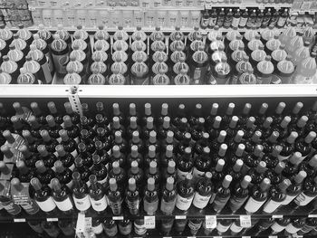 Row of bottles on shelf at store