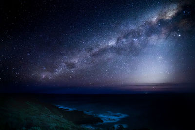 Scenic view of sea against sky at night