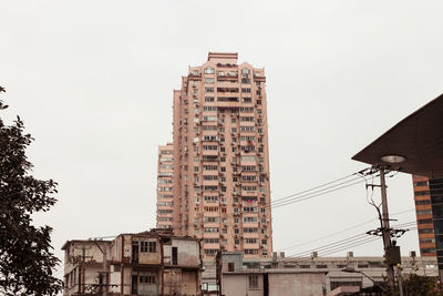 Low angle view of buildings against clear sky