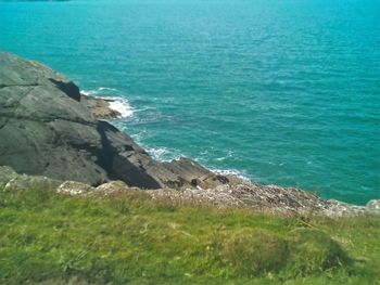 Scenic view of calm sea against blue sky