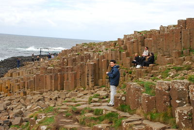 Woman standing on rock formation