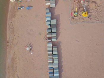 High angle view of beach huts on sand
