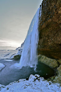 Water splashing against blue sky