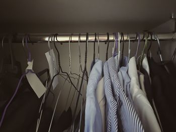 Close-up of clothes hanging in rack