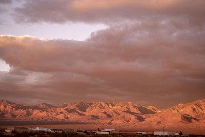 Scenic view of snowcapped mountains against sky during sunset