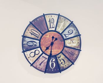 Close-up of clock against white background