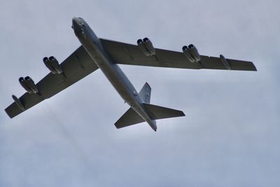 Low angle view of airplane against sky