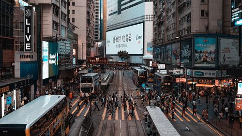 High angle view of people walking on city street