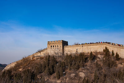 Low angle view of fort against blue sky