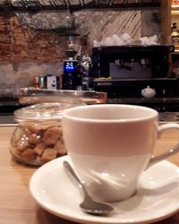 Close-up of coffee served on table at cafe