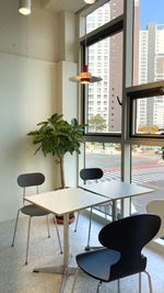 Empty chairs and tables in cafe