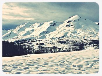 Scenic view of snow covered field