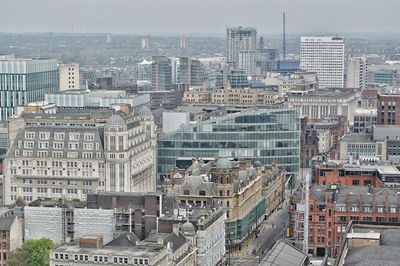 High angle view of buildings in city against sky