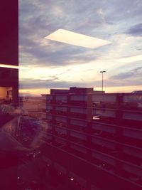 Clouds over city at sunset