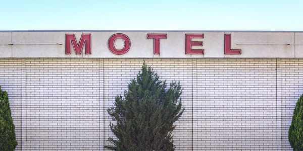 Low angle view of text on building against sky