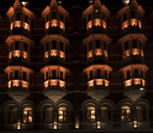 Low angle view of illuminated building at night