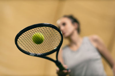 Low angle view of tennis player holding racquet