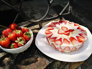 High angle view of strawberries in plate on table