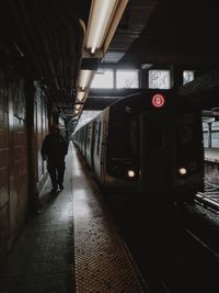 Woman walking in tunnel
