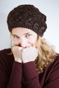 Portrait of mature woman against white background