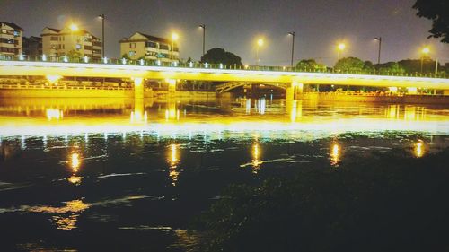 Reflection of building in water at night