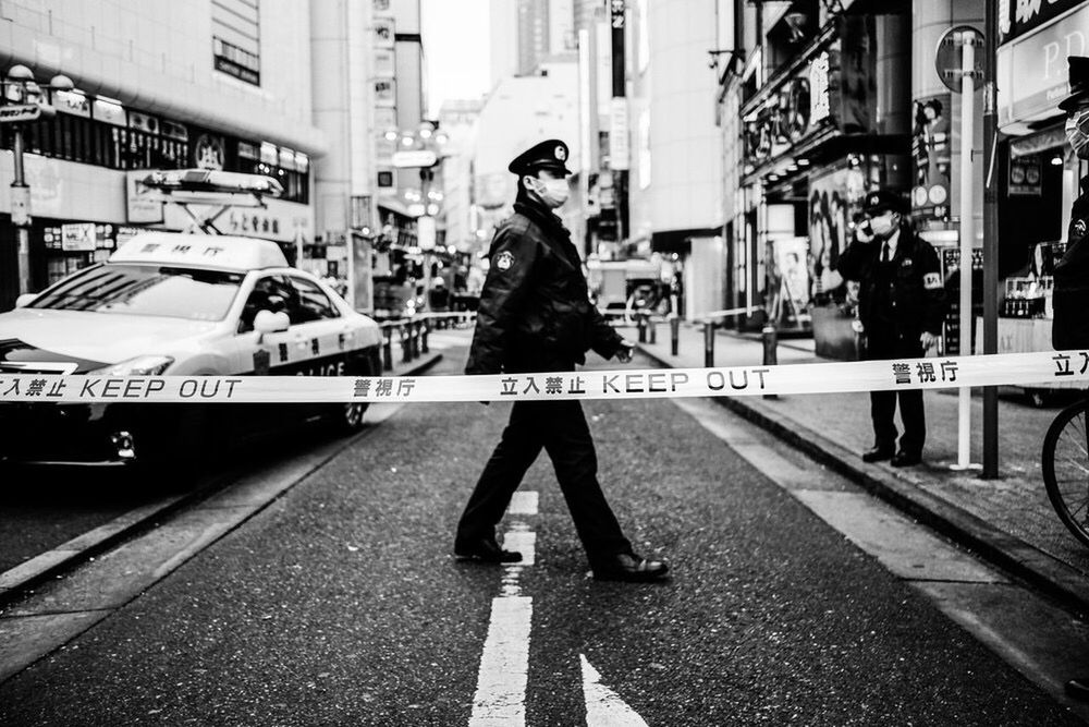 FULL LENGTH OF MAN STANDING ON STREET