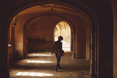 Woman standing in corridor