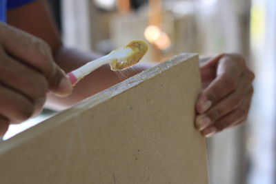 Cropped hands of carpenter working at workshop