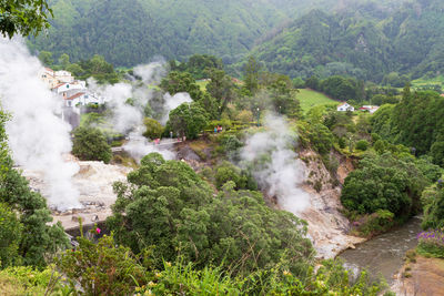 View of steam venting from hot springs in the thermal park in furnas, azores, portugal