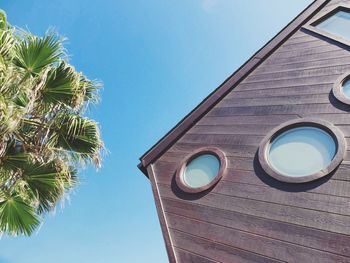 Low angle view of built structure against clear blue sky